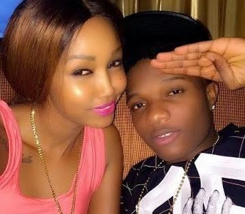 Photos Of WizKid Kissing Huddah Monroe