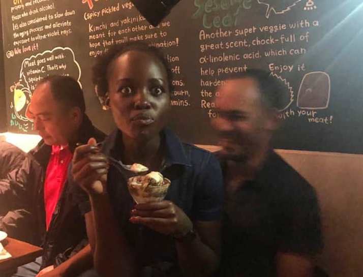 New Boyfriend? Lupita Nyong’o Spotted Sitting On A Man’s Lap (PHOTOS)